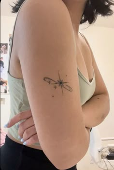 a woman with a small tattoo on her arm