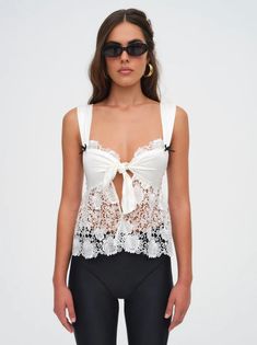 Embrace boldness in our Josette Top White! Not just dainty, this spring brings daring alternate styles for those who love to take risks. Let your confidence shine in this top that challenges the norm. With small black bows by the straps and flower embroidery, don't settle for the ordinary! floral embroidery black bow details | For Love & Lemons Women's Josette Top in White, Size Small Summer In Europe, Black Bows, Cut Offs, White Lace Top, Rose Lace, Simple Chic, Take Risks, Flower Embroidery, Black Bow