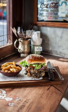 a tray with a sandwich and some fries on it