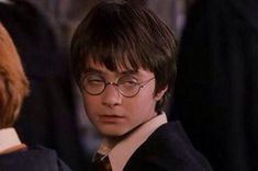 the young harry potter is wearing glasses