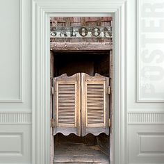 an old fashioned wooden cabinet with shutters on the front and side doors open to let light in