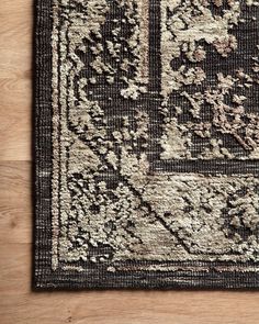 an area rug with black and white designs