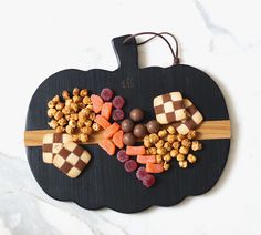 a cutting board with candy and candies on it