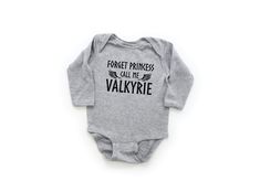 Forget Princess Call Me Valkyrie Long Sleeve Bodysuit | Shield Maiden Infant Outfit | Baby Viking Clothing | Raid with Lagertha Romper Our super soft long sleeve bodysuits feature lap shoulders to make dressing easier. 5 ounce, 100% combed cotton. Flatlock side seams with ribbed binding at neck, shoulders, sleeves, and leg openings. Reinforced three-snap closure. PRODUCT CARE Feel free to wash, dry or hang any of our products, but we always recommend them to be done in a gentle cycle! SHIPPING & PROCESSING TIME All items are made to order and take 2-5 days to be made and 2-5 days for shipping. During normal production times you should have your product in hand within 10 days. During the holiday season and periods of high volume sales, it could take up to two weeks to receive your order. PO Toddler Viking Costume Girl, Viking Maternity Dress, Viking Nursery, Viking Baby Nursery, Baby Onsies Ideas, Lotr Onesie, Game Of Thrones Onesie, Baby Lemur, Viking Baby