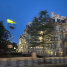 blurry photograph of an old building at night