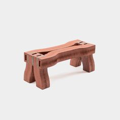 a wooden bench made out of bricks on a white background