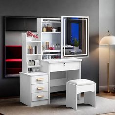 a white desk with a mirror, stool and shelf next to it in a room