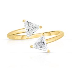 two yellow gold rings with white diamonds on them, one has a triangle shaped diamond in the middle