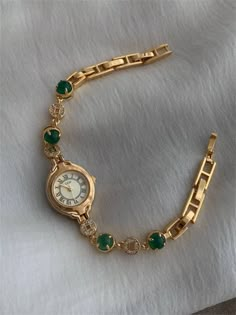 Welcome to AffordLuxe Watches! We're delighted to have you here in our store 🤩 This exquisite gold-plated bracelet watch is the perfect blend of luxury and elegance. Featuring a delicate round dial with Roman numerals and a timeless design, this watch is adorned with stunning green gemstones and sparkling crystal accents. The combination of the rich gold tone and vibrant green stones creates a sophisticated look that is sure to turn heads. ★Material: - Stainless Steel  - Glass - Copper  - Plast Gold Watches Women Vintage, Delicate Watches Women, Bangle Watches Women, Small Watches Women Vintage, Dainty Watches, Gold Vintage Watch, Vintage Gold Watch, Watch Green, Streetwear Jewelry