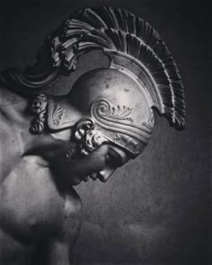 a black and white photo of a roman soldier's helmet