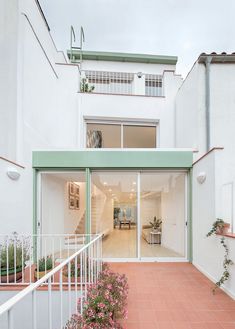 an open patio with stairs leading up to the house