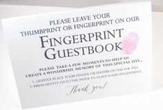 a white greeting card with the words fingerprint guestbook on it and a pink rose