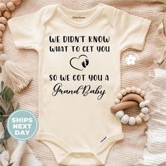 a baby bodysuit that says, we didn't know what to get you so we got you a grand baby