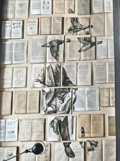 an arrangement of old books with drawings on them