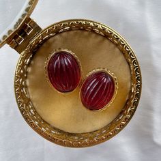 Very good vintage condition, signed, heavy with red glass cabochon. Rare find.Disclaimer: This item is an Estate/Antique Sale/Fair Find. Item is described to the best of my ability. Please contact me if you have any questions or wish to see additional photos prior to buying. Thank you! Vintage Oval Cabochons For Formal Occasions, Mid-century Handmade Earrings As Gift, Handmade Mid-century Style Earrings For Gifts, Handmade Mid-century Earrings As Gift, Vintage Oval Gold Cabochons, Handmade Oval Vintage Earrings, Victorian Red Oval Cabochon Jewelry, Red Formal Costume Jewelry Earrings, Red Costume Jewelry Earrings For Formal Occasions