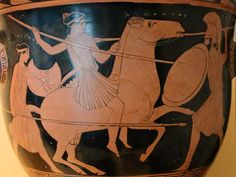 an ancient vase with two men riding horses on the front, and another man holding a spear