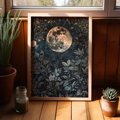 an image of a full moon in the night sky with flowers and succulents