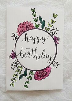 a birthday card with flowers and leaves on it