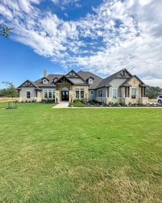 a large house in the middle of a field