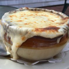 a close up of a food entree on a plate with a spoon in it