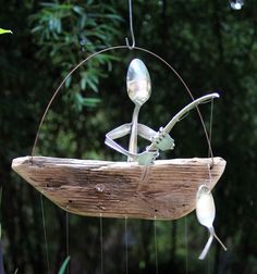 a wind chime hanging from the side of a tree