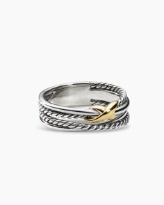 a silver and gold ring with an arrow on the front, set against a white background