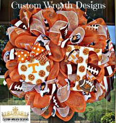 an orange mesh wreath with footballs on it and the words, custom wreath designs