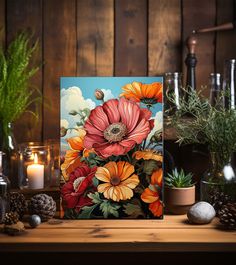 a painting on a table with candles and flowers