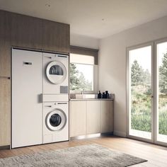 a washer and dryer in a room with wood flooring on the walls