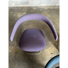 two purple chairs sitting next to each other