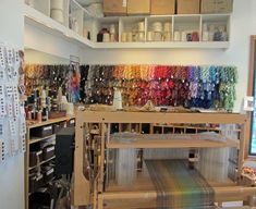 a room filled with lots of different types of yarn