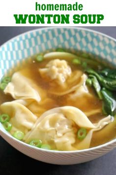 a bowl of wonton soup with green beans and asparagus on the side