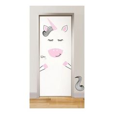 the door is decorated with an image of a unicorn's face and pink manes