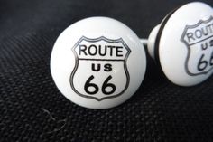 two white buttons with the words route 66 on them