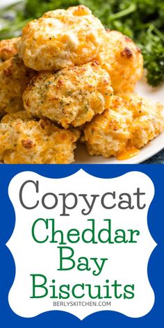 some crab cakes and broccoli on a white plate with the words copycat cheddar bay biscuits