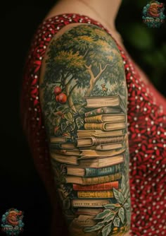 a woman's arm with books on it and an apple tree in the background