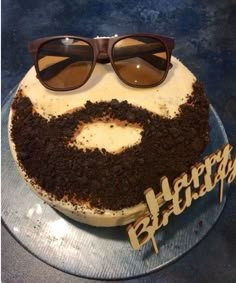 a birthday cake with sunglasses on top of it