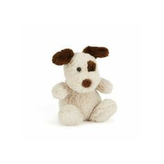 a white stuffed dog with brown ears and nose sitting on the ground in front of a white background