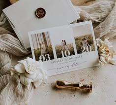 a couple's wedding photos are displayed on top of an envelope and some flowers