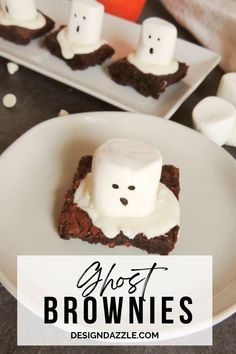 brownies with marshmallows in the middle and ghost faces on top for halloween