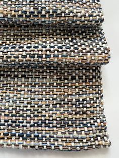 three pieces of woven material are stacked on top of each other