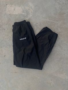 "Vintage 1980s Adidas Black Track Pants - Size XL - Outseam 42\", Inseam 32\" - Overall great vintage condition (small stain pictured) - Message for more information Please take note of the measurements listed as these are vintage clothes and may fit different than the tag size. Follow our page for more vintage clothing drops! Connect with us on Instagram: @recurarchives" Vintage Brown Nike Track Pants, Parachute Pants 80s, 80s Track Suit, Jogging Adidas, Adidas Jogger, 80s Adidas, Summer Sportswear, Black Track Pants, Streetwear Graphic Tees