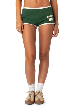 Rep your favorite city in these vibrant cotton knit shorts designed in a leggy silhouette with contrasting trim. 95% cotton, 5% spandex Machine wash, dry flat Imported Green Shorts Outfit, Streetwear Shorts, Contrasting Trim, Black Graphic Tees, Swimwear Dress, Fashion Catalogue, Mini Shorts, Designer Shorts, Back To School Outfits