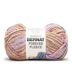 bernat forever fleece yarn in pink, beige and blue colors on a white background