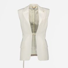 • Classic collar
 • Sleeveless design
 • Slim fit
 • Hook closure
 • Solid color
 • Made of viscose and wool Sleeveless Jackets For Women, Elegant Skirt, Sleeveless Jacket, White Sleeveless, Tailored Trousers, Victoria Beckham, In Style, Timeless Fashion, Jackets For Women