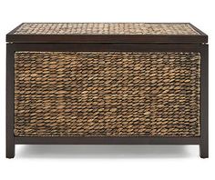 a brown wicker chest with two drawers on the top and one drawer open to show an