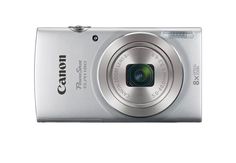 a silver digital camera sitting on top of a white surface