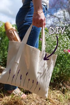 a person carrying a bag with flowers on it and the words diy written in purple