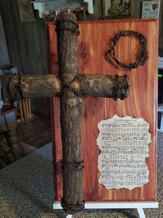 a cross made out of wood with writing on it