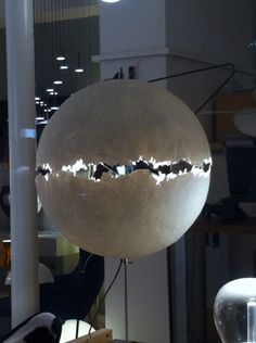 a large white ball hanging from the ceiling